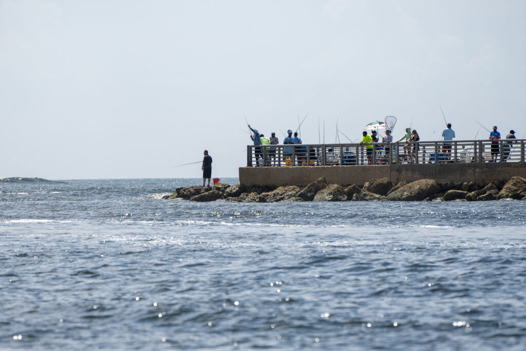 Your Beginner's Guide to Fishing in Florida - Pier fishing at Sebastian Inlet