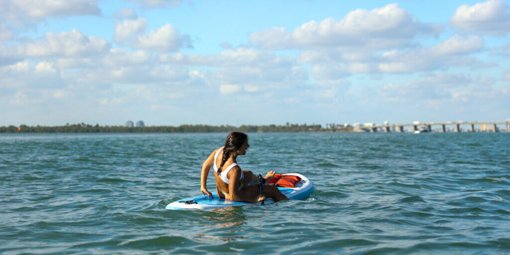 Woman Paddle Boarding in Miami: June Nature Events in Florida