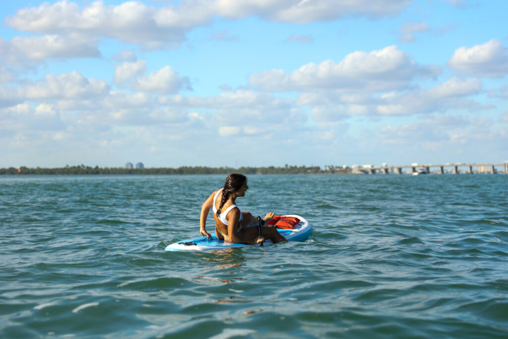 Woman Paddle Boarding in Miami: June Nature Events in Florida